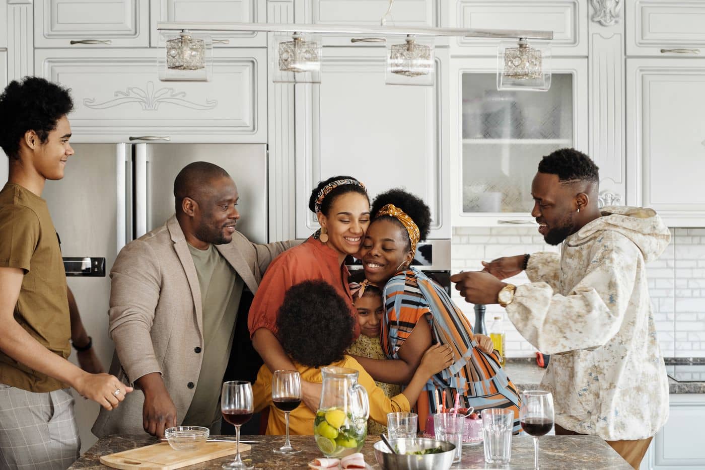 Family laughing together in the kitchen